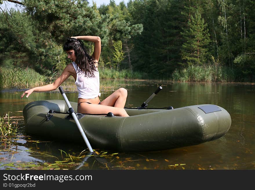 Lovely girl in boat in summertime