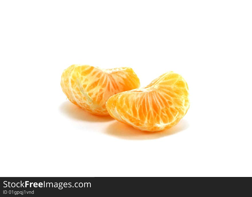 Orange segments of a tangerine isolated on a white background