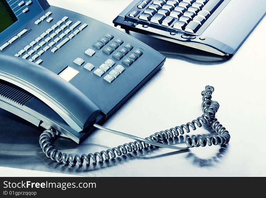 Business concept - keyboard, telephone - high key