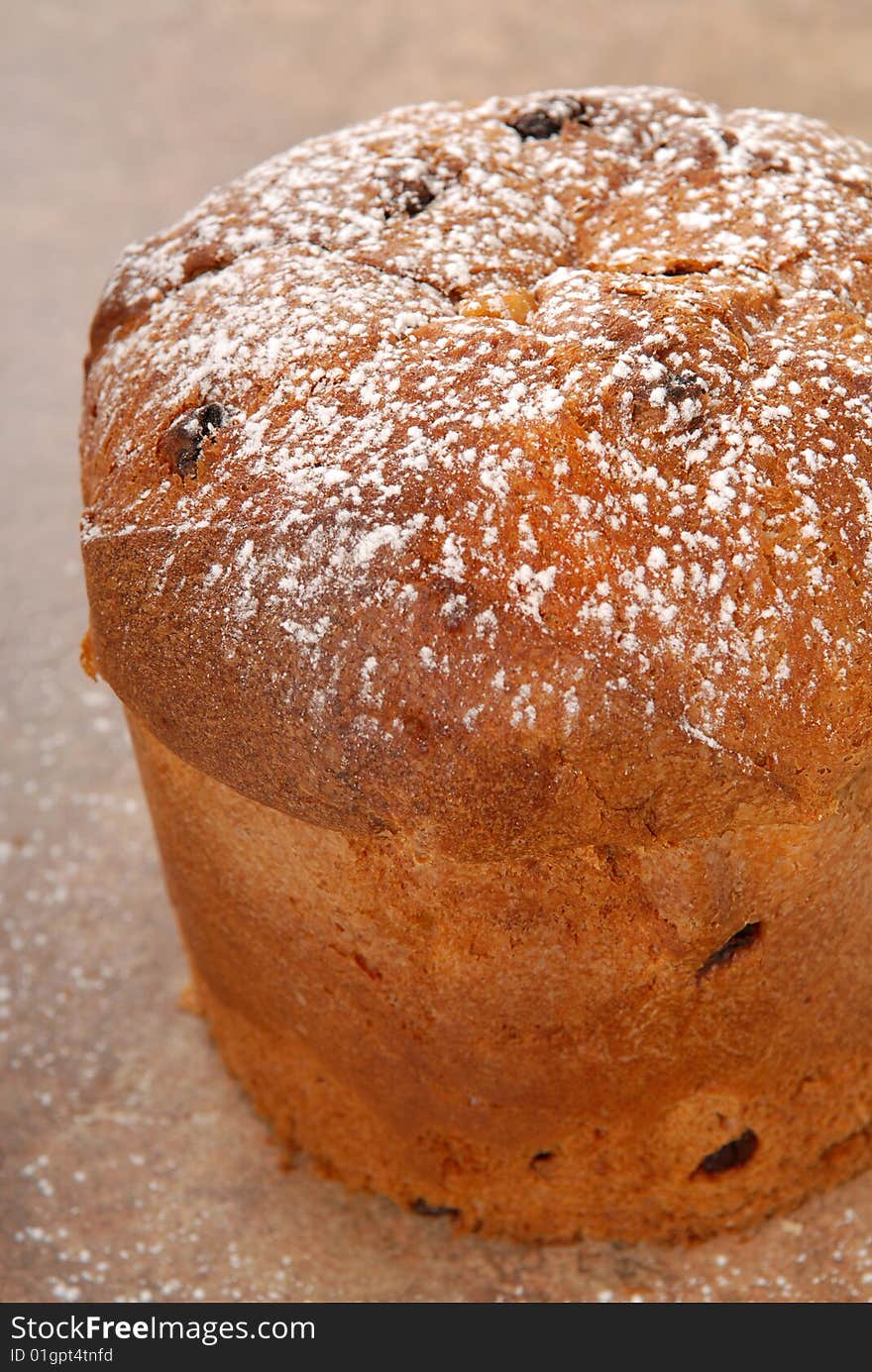 Freshly baked Italian Panettone Christmas Bread with powdered sugar