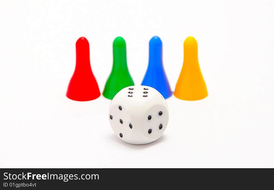 Dice and four pieces isolated on white background