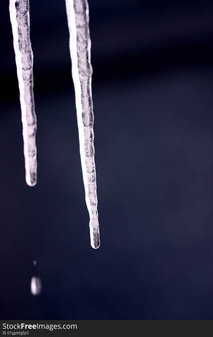 Falling drop of water from melted icicles