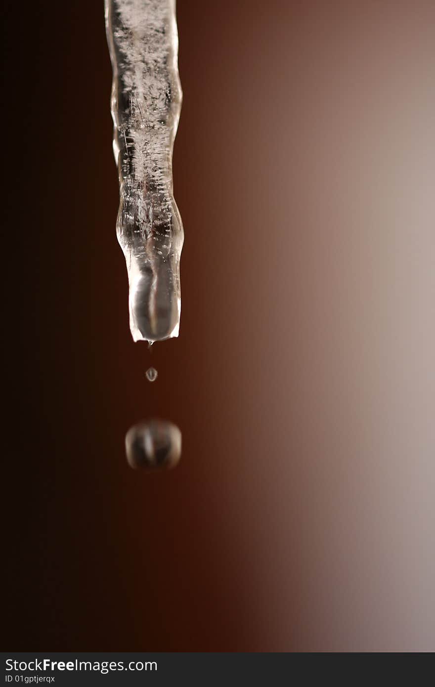 Falling drop of water from melted icicles