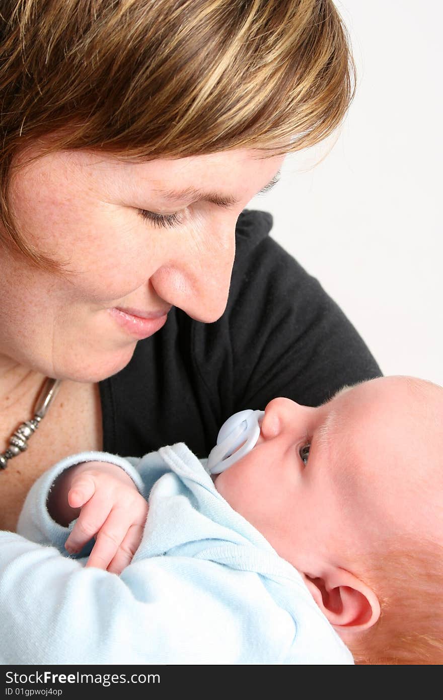 Loving mother holding her new baby boy. Loving mother holding her new baby boy