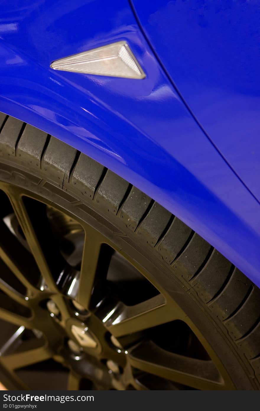 Low angle shot of a car and wheel. Low angle shot of a car and wheel