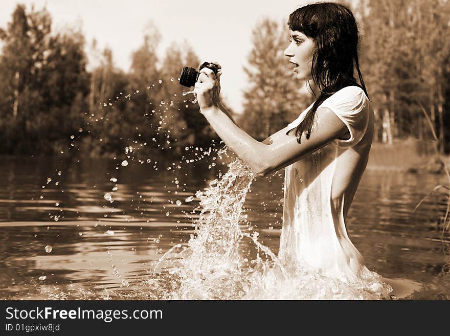 Photographer in water with camera