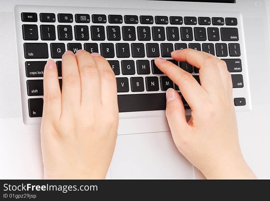 Girl hands typing on keyboard