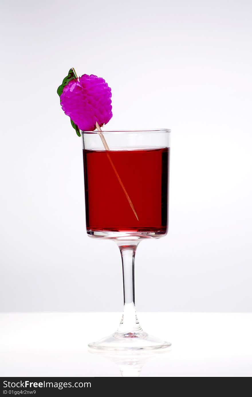 Red cocktail glass on a clean white background