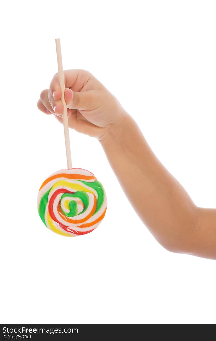 Color lollipop in child hand