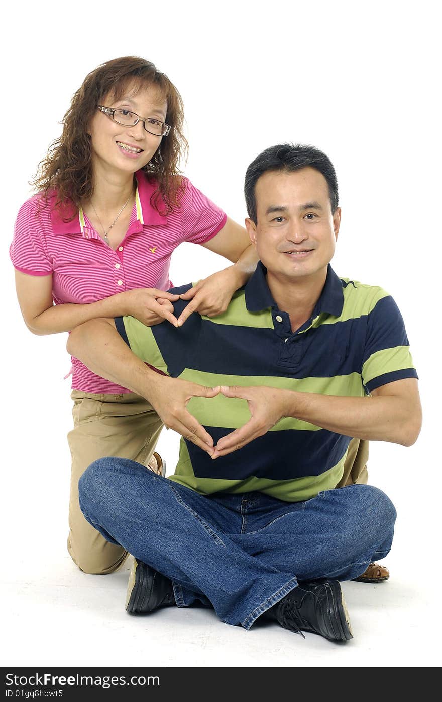 Couple hands forming a heart symbol. Couple hands forming a heart symbol