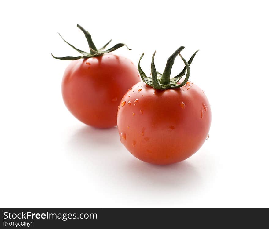 Fresh cherry tomatoes on white background