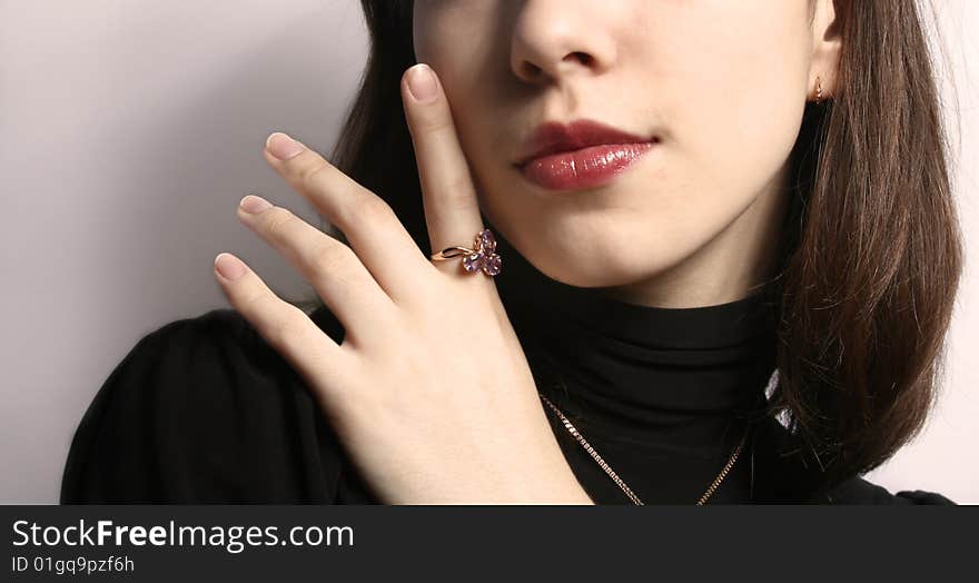 Portrait of the girl with a ring on a hand close up. Portrait of the girl with a ring on a hand close up.