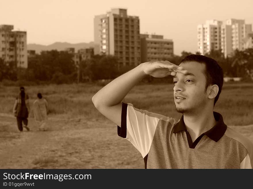 A young waiting and looking over for his friend. A young waiting and looking over for his friend.