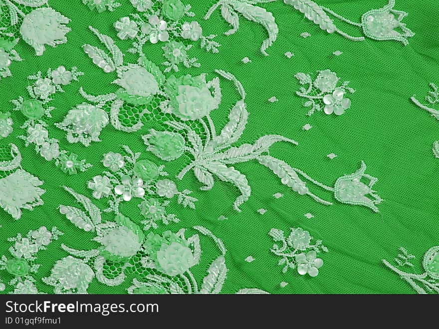 Silk green  lace ornament color texture. Silk green  lace ornament color texture