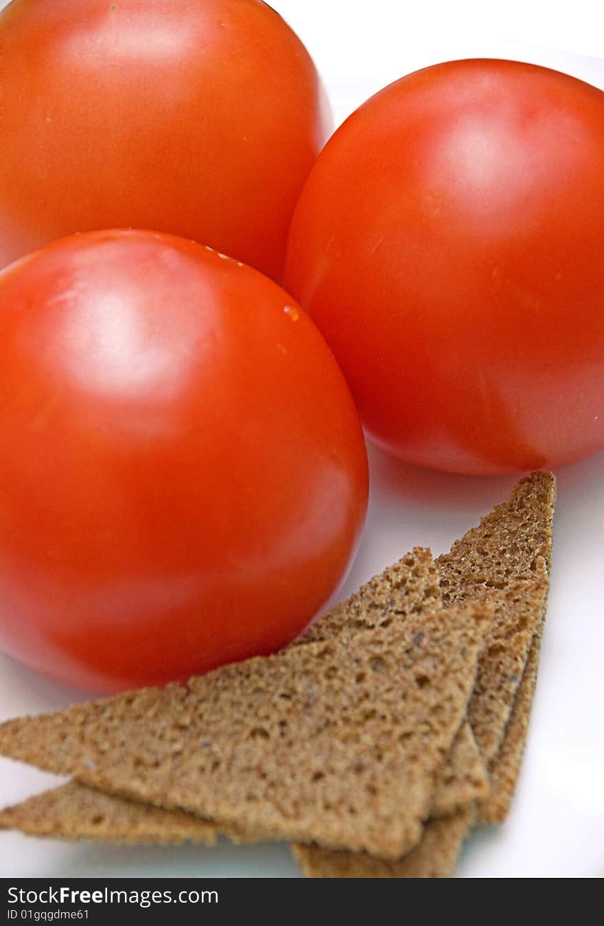 Red fresh tomato and bread. Red fresh tomato and bread