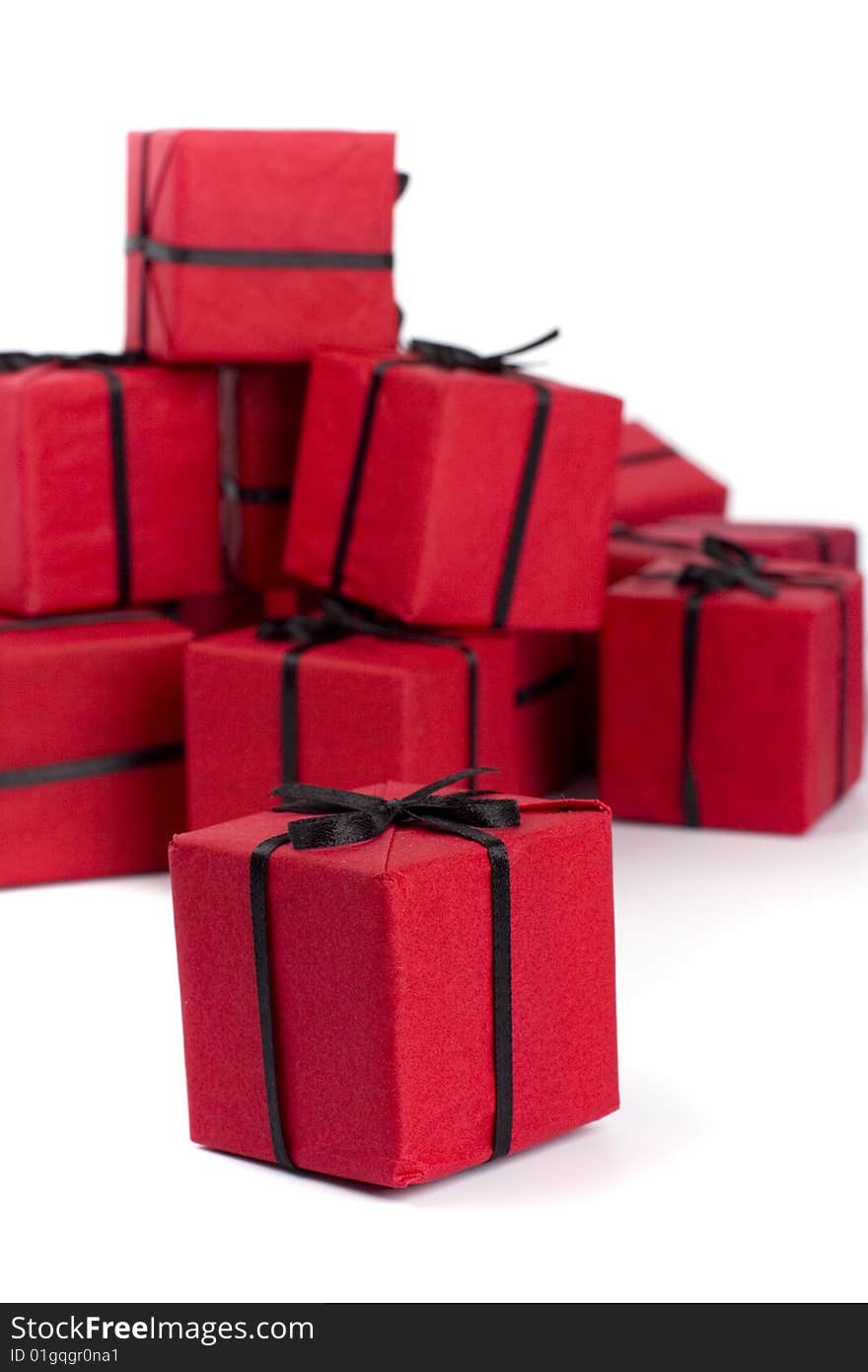 Red gift boxes closeup on white background