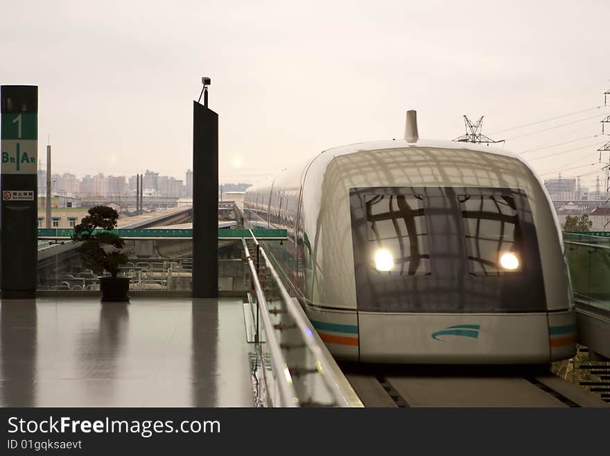 Shanghai's high speed train coming into the station, it runs at 428 Km/hr. Shanghai's high speed train coming into the station, it runs at 428 Km/hr