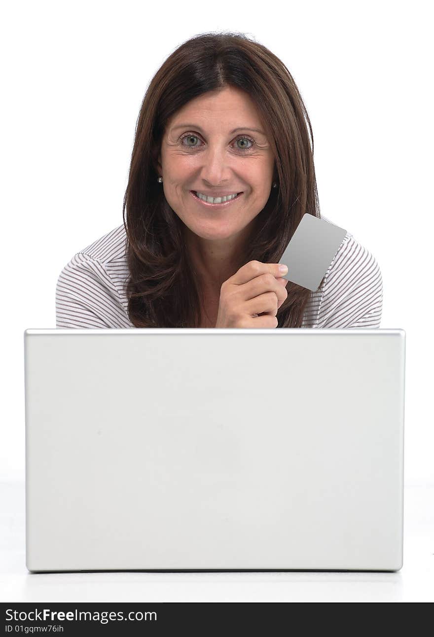 Woman buying online on a laptop with a credit card