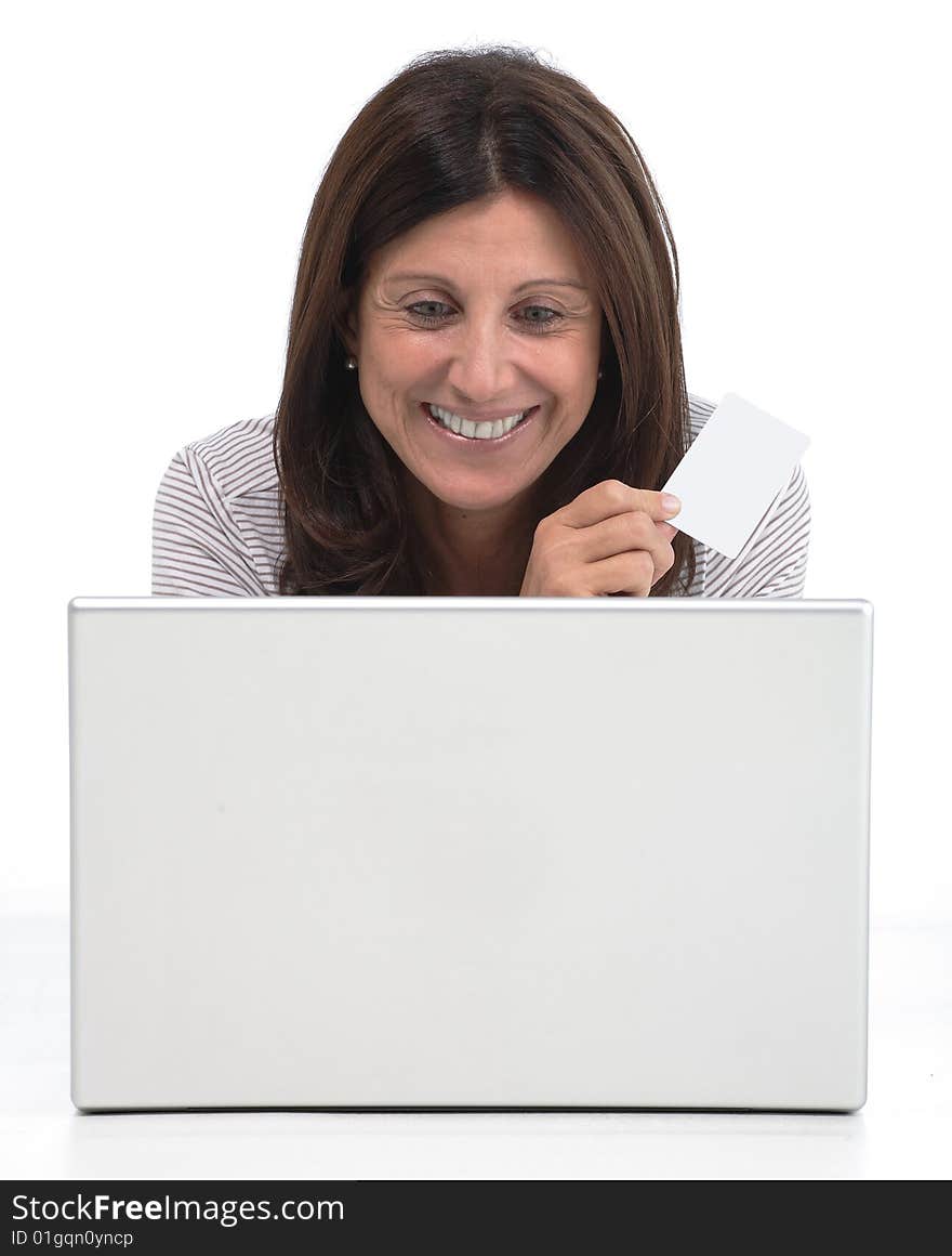 Woman buying online on a laptop with a credit card