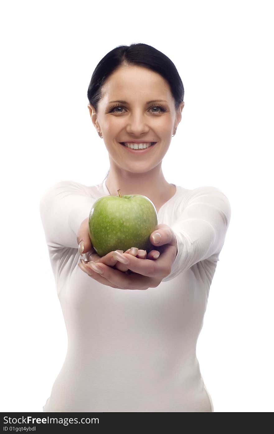 Young woman with apple smiling over white background