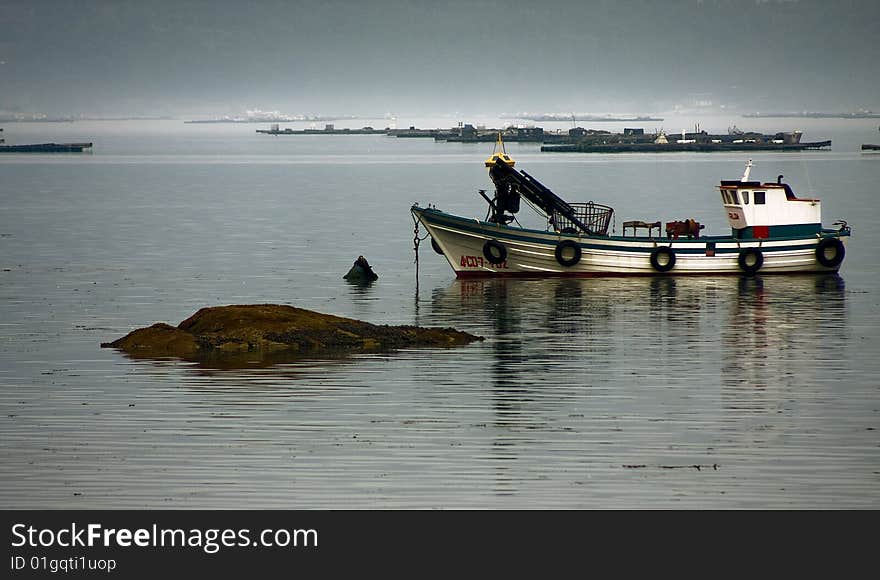 Fishing boat at anchor, seascape