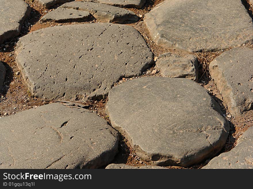 Very old roman stone pavement near the Colosseum , Italy. Very old roman stone pavement near the Colosseum , Italy