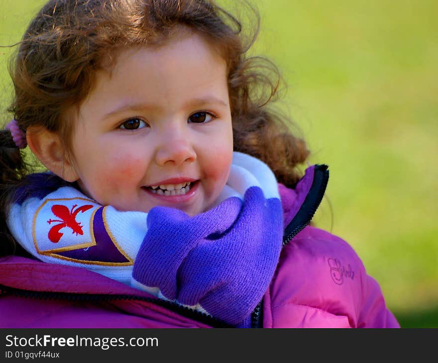 A wonderful image of a little smiling  baby with the Fiorentina soccer team scarf. A wonderful image of a little smiling  baby with the Fiorentina soccer team scarf