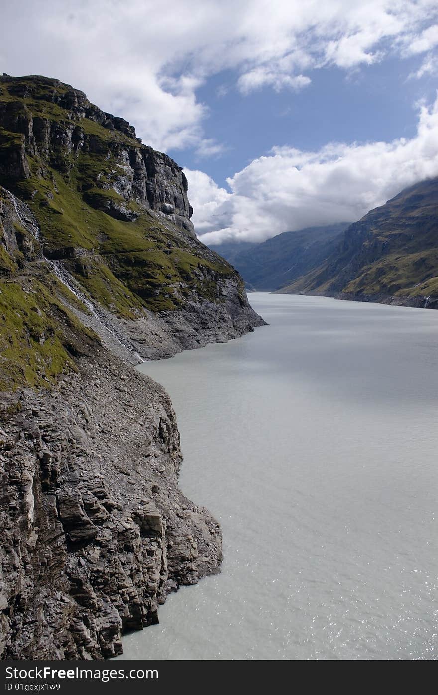 View on swiss high  mountain lake in Switzerland, vertical. View on swiss high  mountain lake in Switzerland, vertical