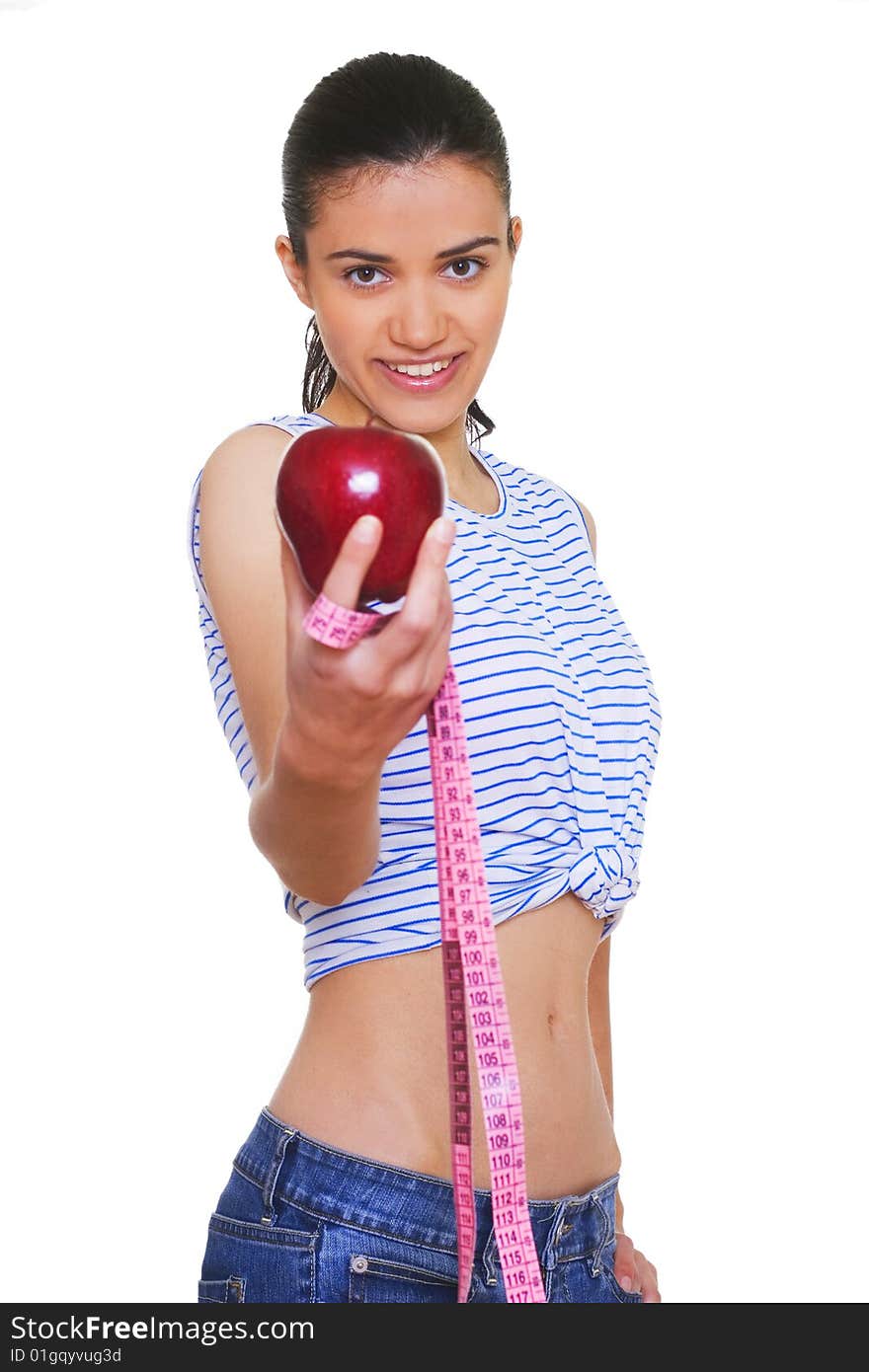 Portrait of cute young woman holding red apple and measuring tape. Portrait of cute young woman holding red apple and measuring tape