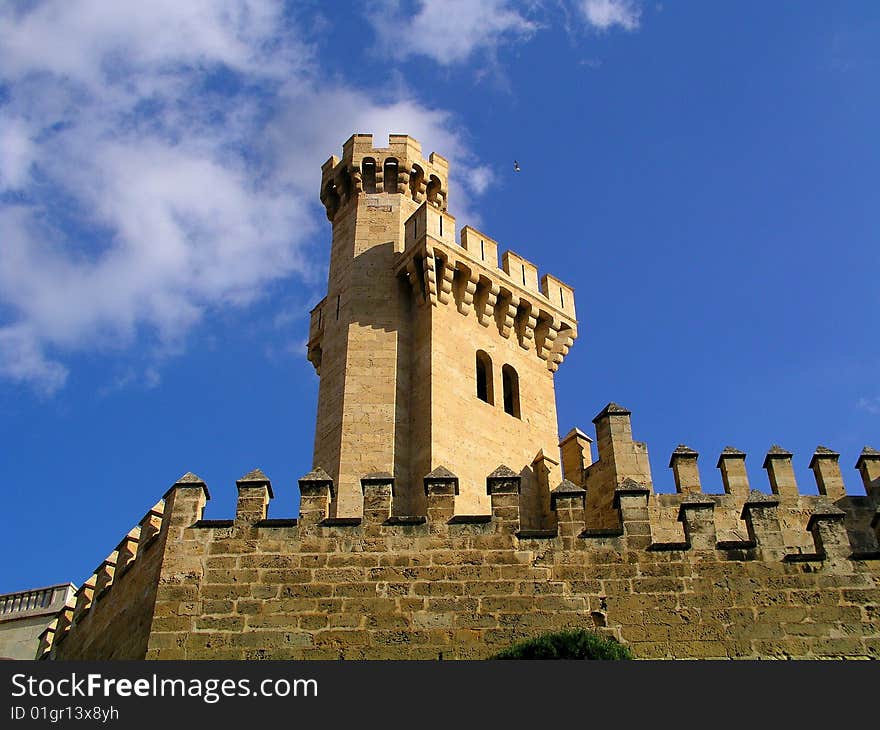 Spanish castle against blue cloudy sky