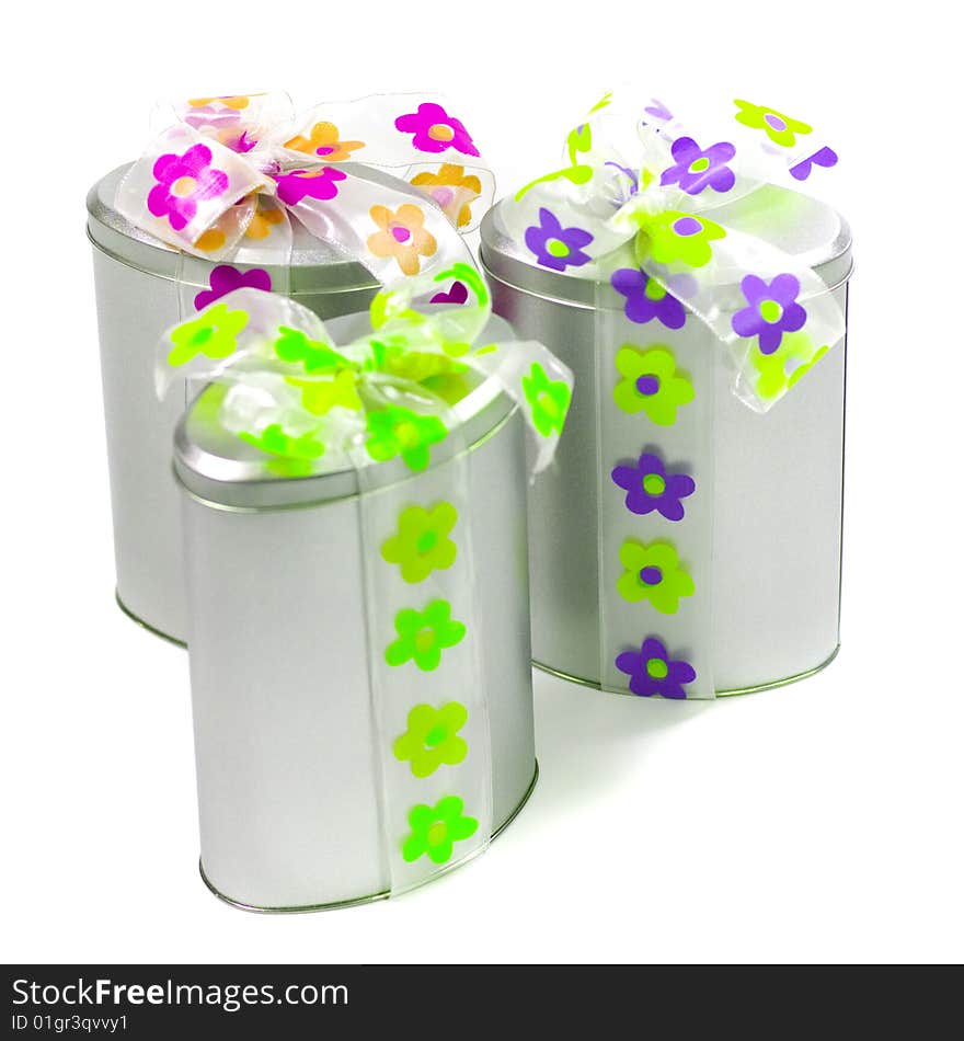 Tree beautiful metal gift boxes with colorful bows