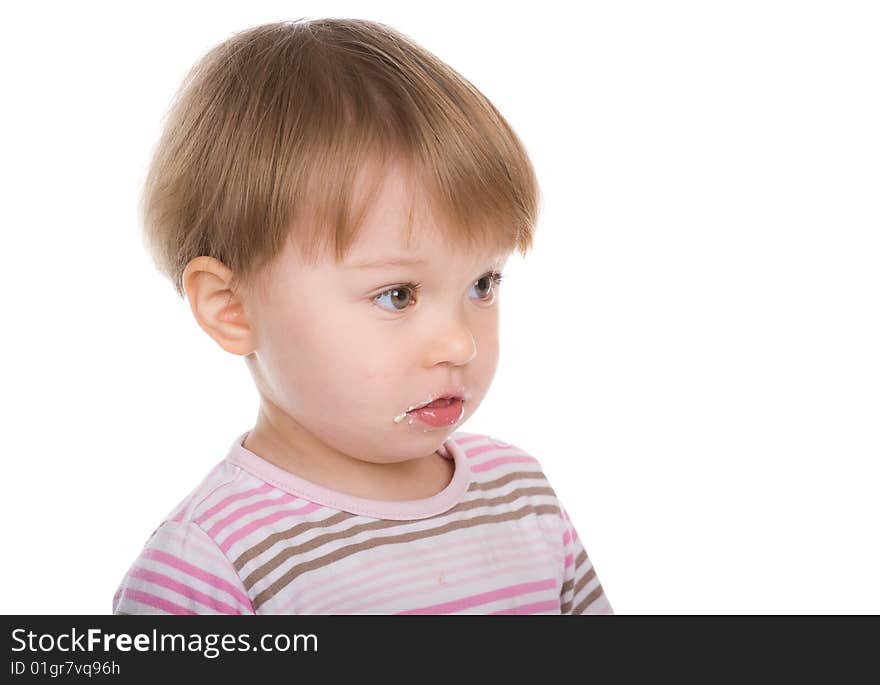 Happy baby girl eating isolated