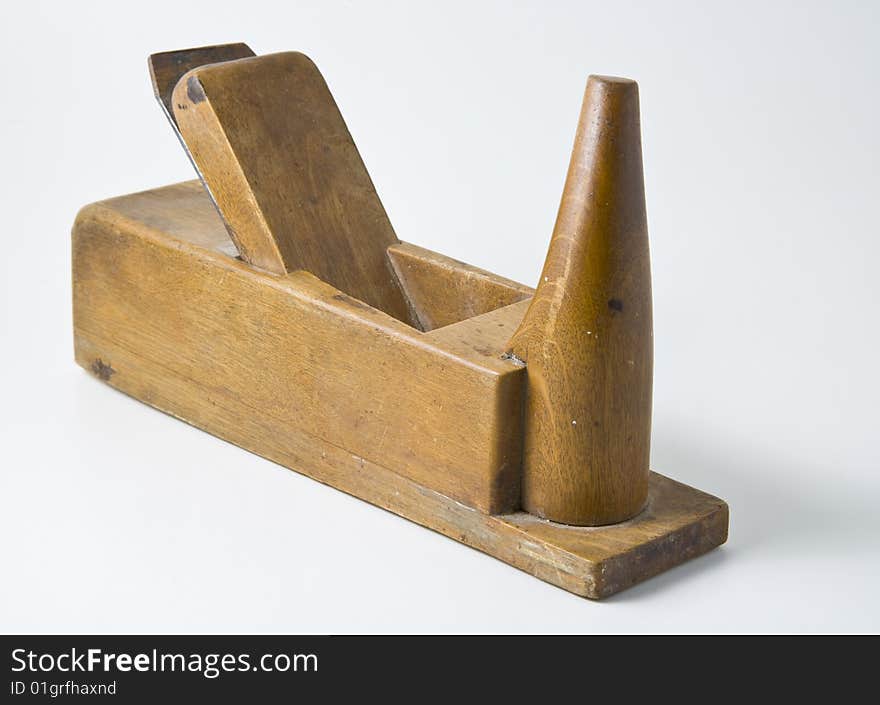 Old joinery plane on white background