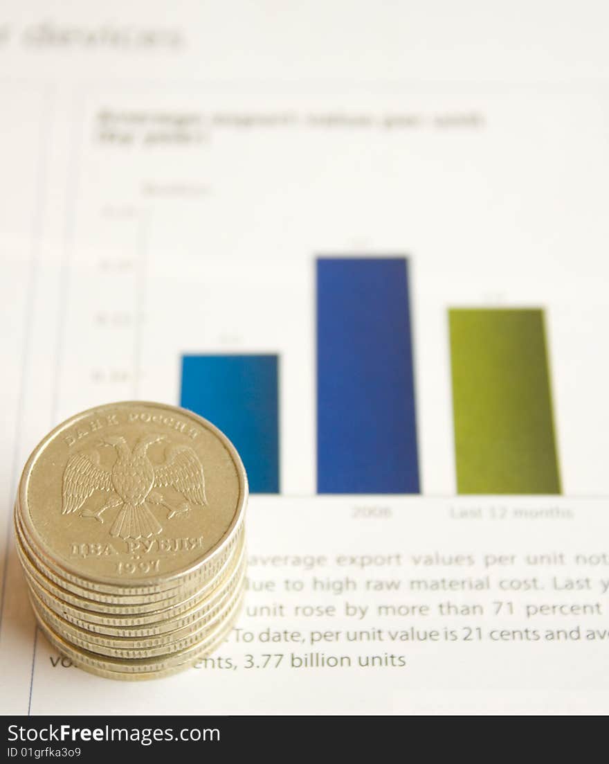 Coins to rest upon document with diagram