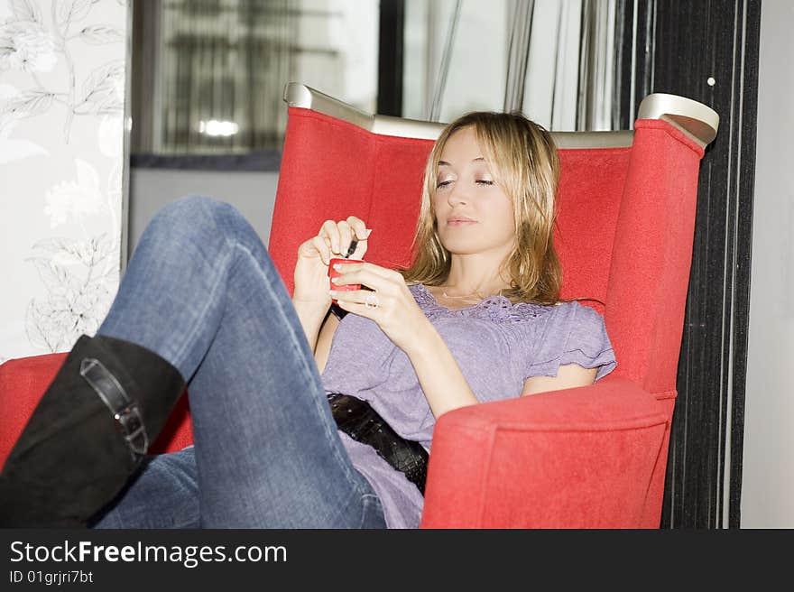 Beautiful woman eating yogurt at home