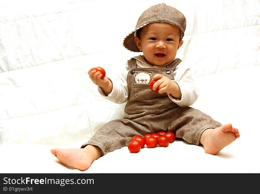 Smiling Child with Tomato