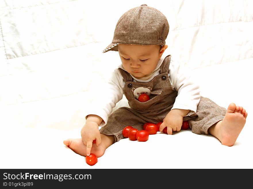 Cute Child Playing Tomato