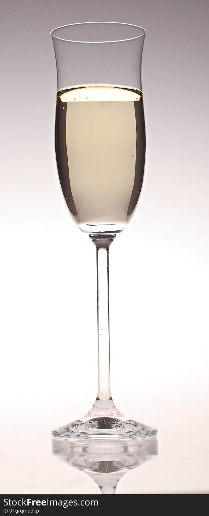 An isolated glass of champagne.