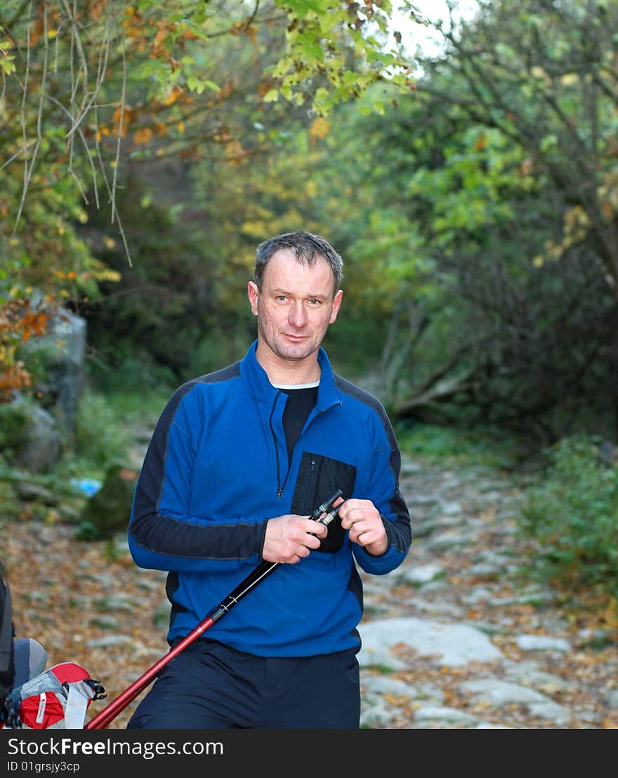 Clear morning. Hiker prepares for travel