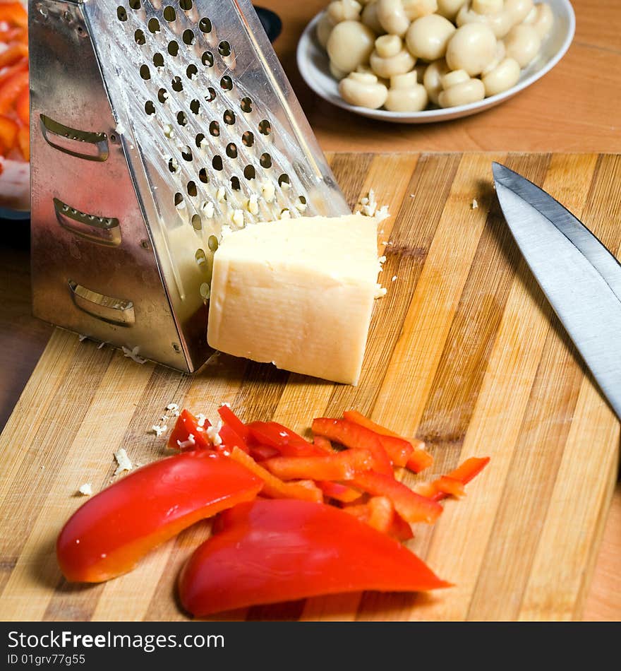 Stock photo: an image of food in the kitchen: mushrooms, paprika and cheese. Stock photo: an image of food in the kitchen: mushrooms, paprika and cheese