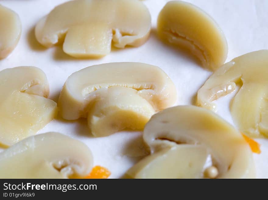 Stock photo: an image of a background of mushrooms on dough