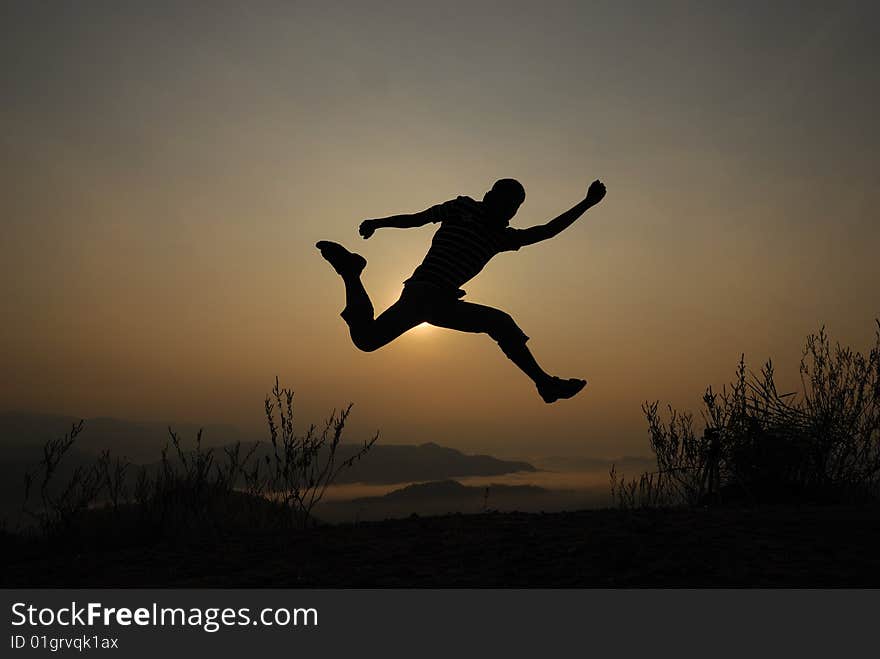 Mans silhouette on the sunset. Mans silhouette on the sunset