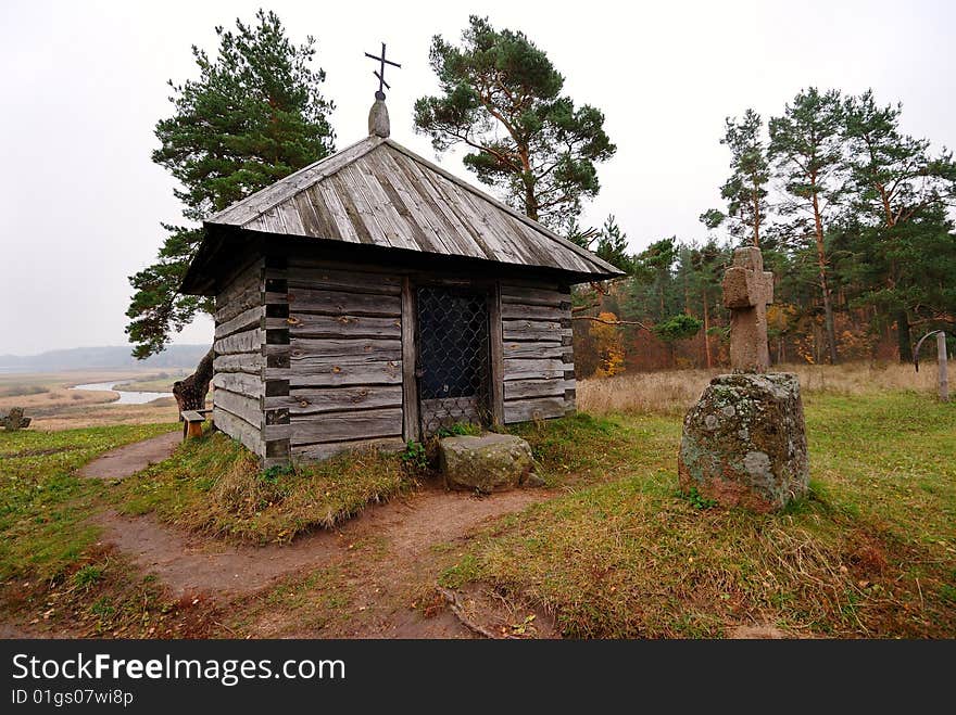 The ancient chapel with a cross. The ancient chapel with a cross