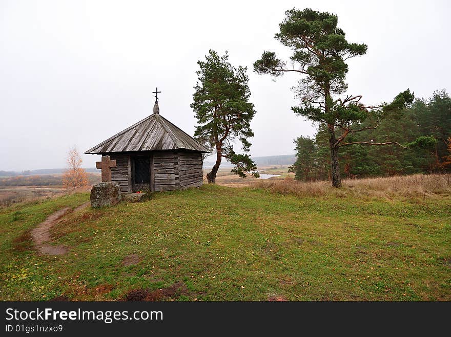 The ancient chapel with a cross. The ancient chapel with a cross