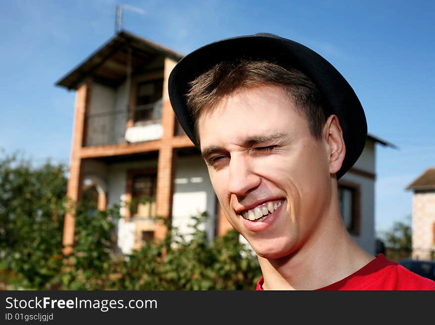 Young happy man at him new house. Young happy man at him new house