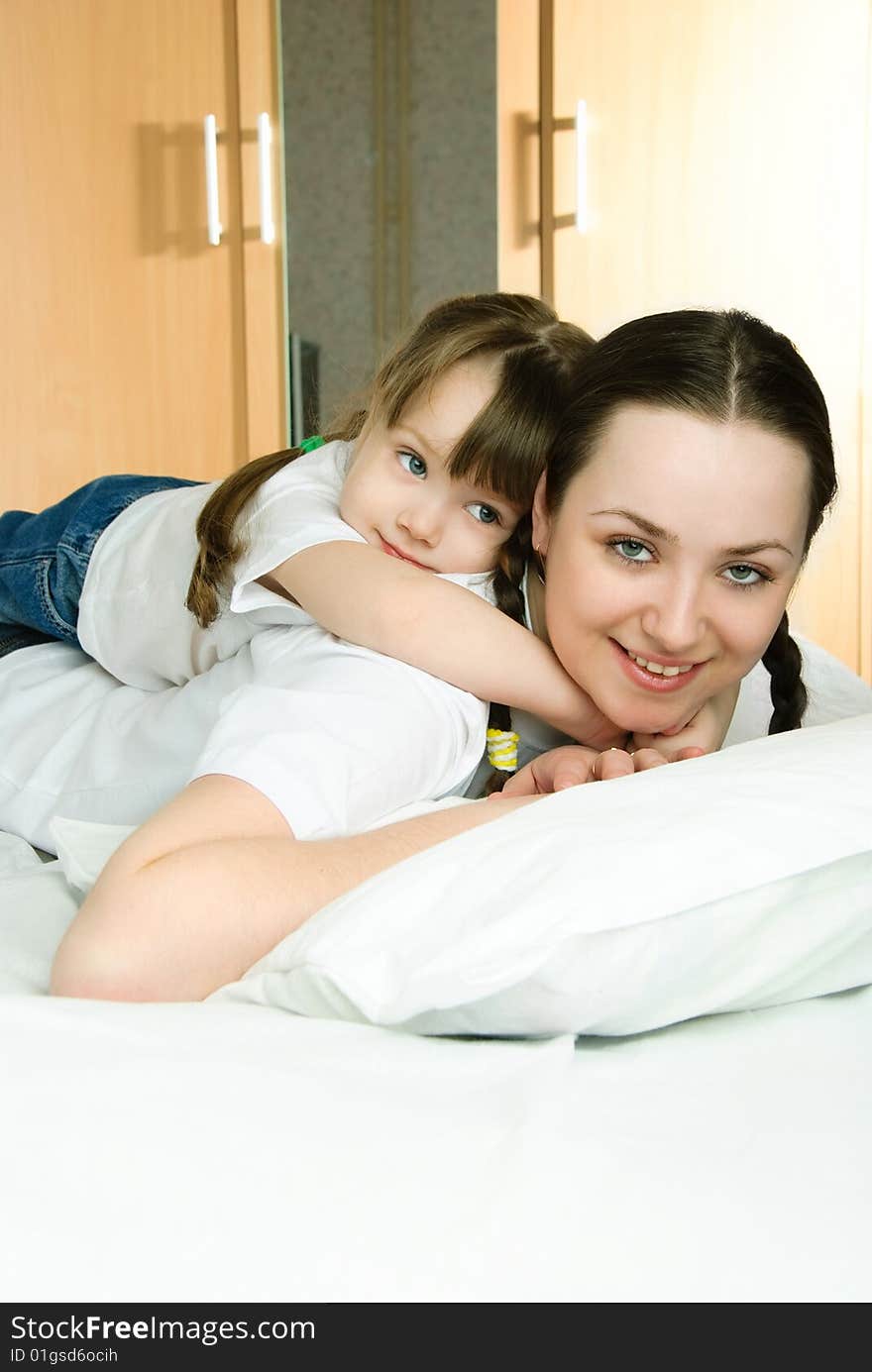 Mother and daughter on the bed