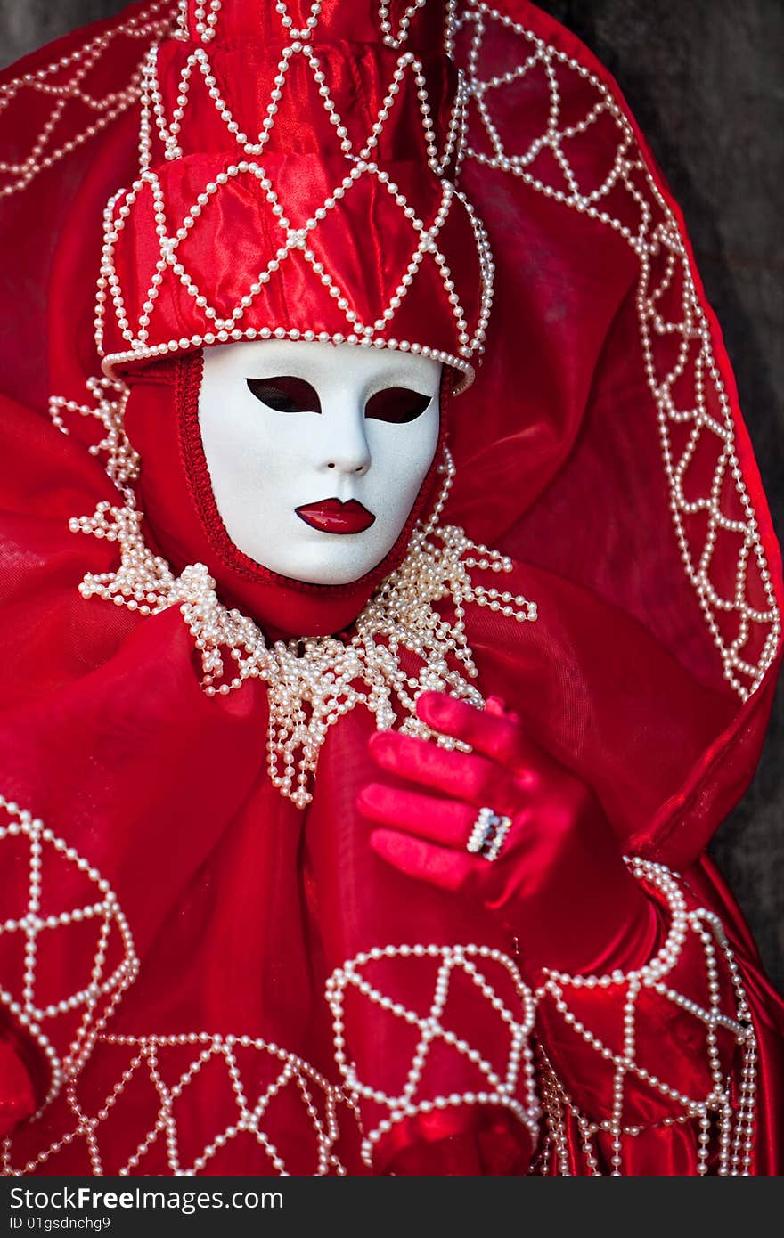 Red costume with white pearls at the Venice Carnival. Red costume with white pearls at the Venice Carnival