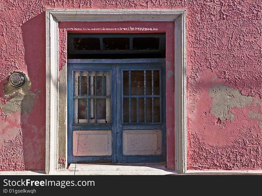 Blue windows, pink walls and white trim