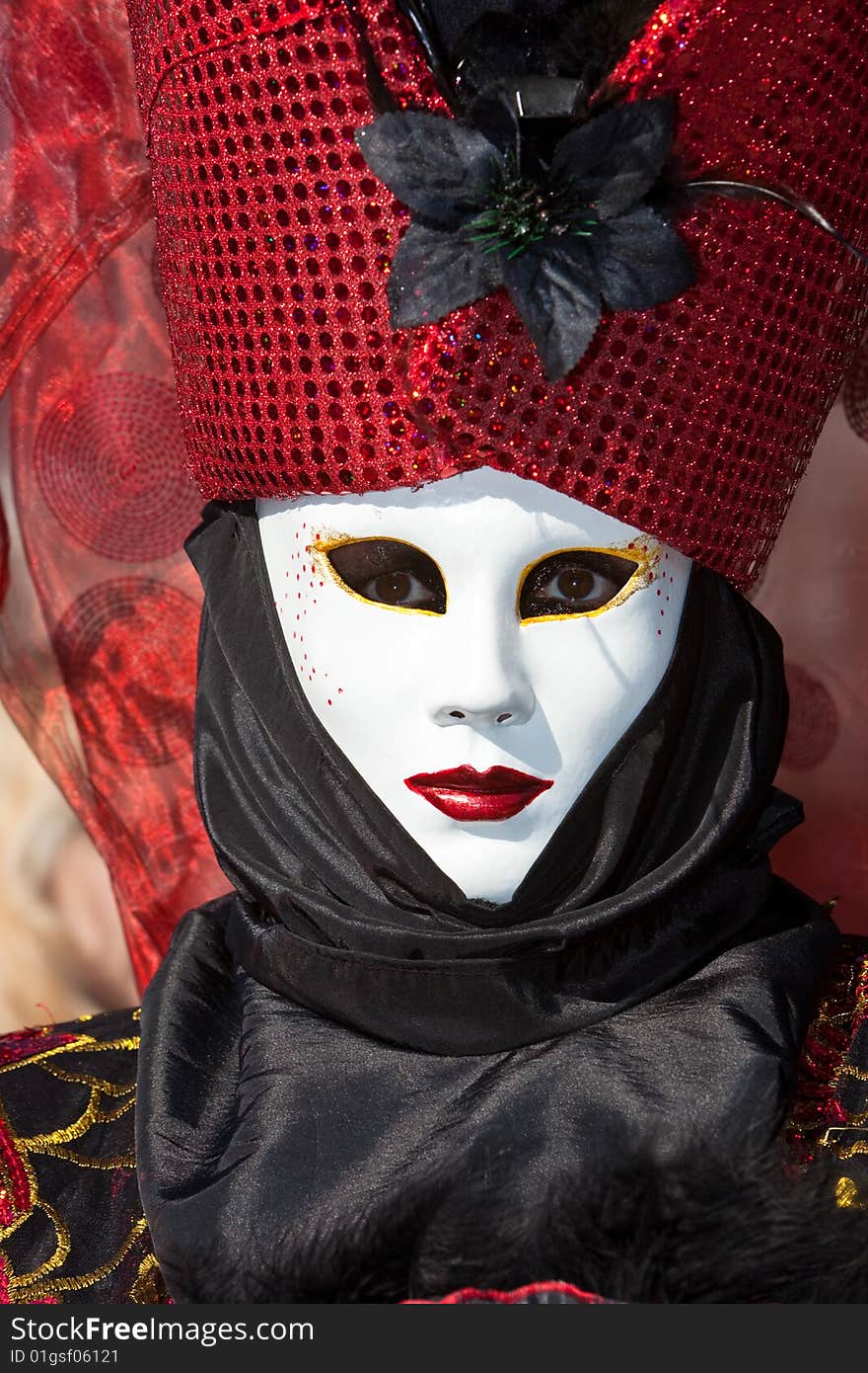 Red and black costume at the Venice Carnival. Red and black costume at the Venice Carnival