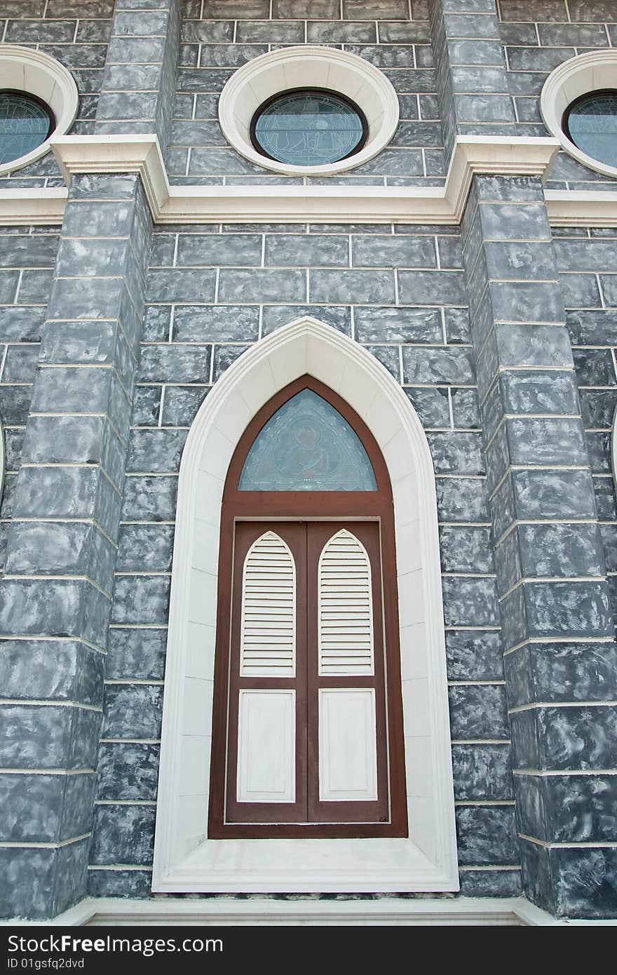 Gothic style window of over 100 years old church in Ratchaburi province, Thailand. Gothic style window of over 100 years old church in Ratchaburi province, Thailand.